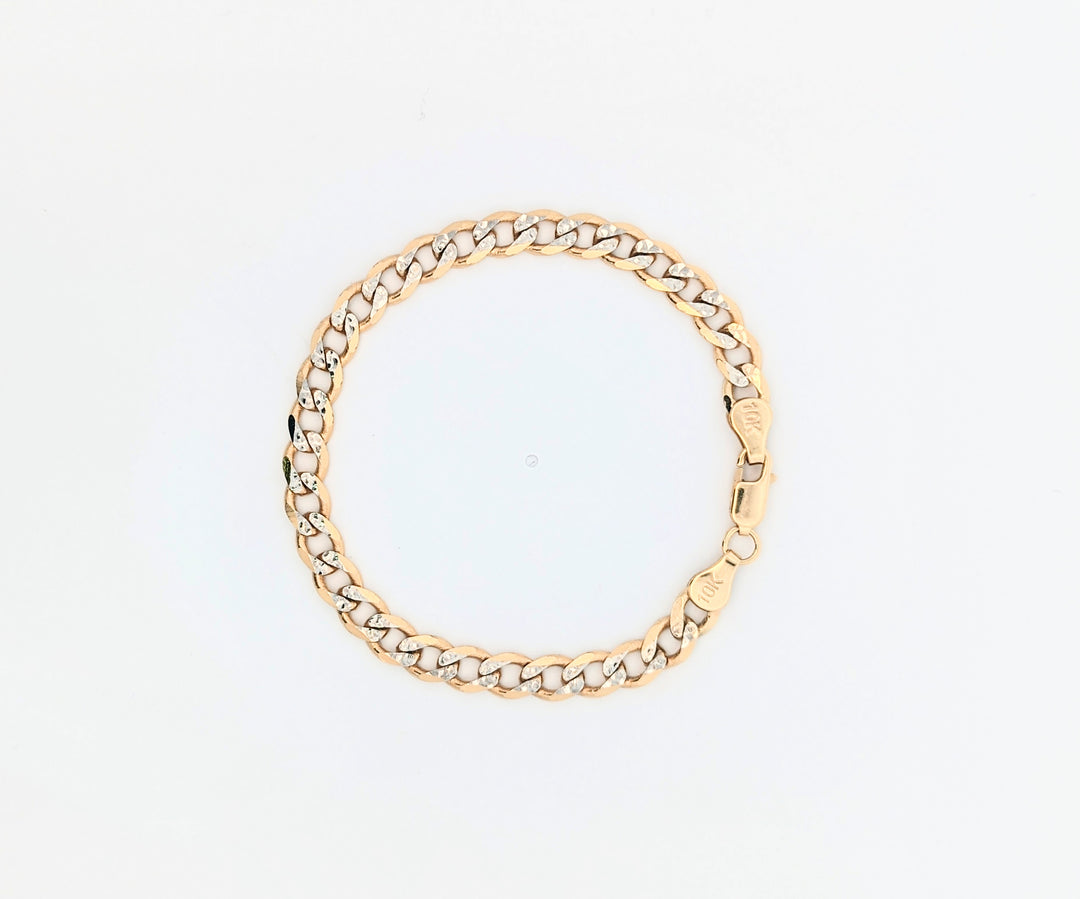 10k yellow gold flat curb link bracelet with white gold diamond cuts. 7 inch 6mm
