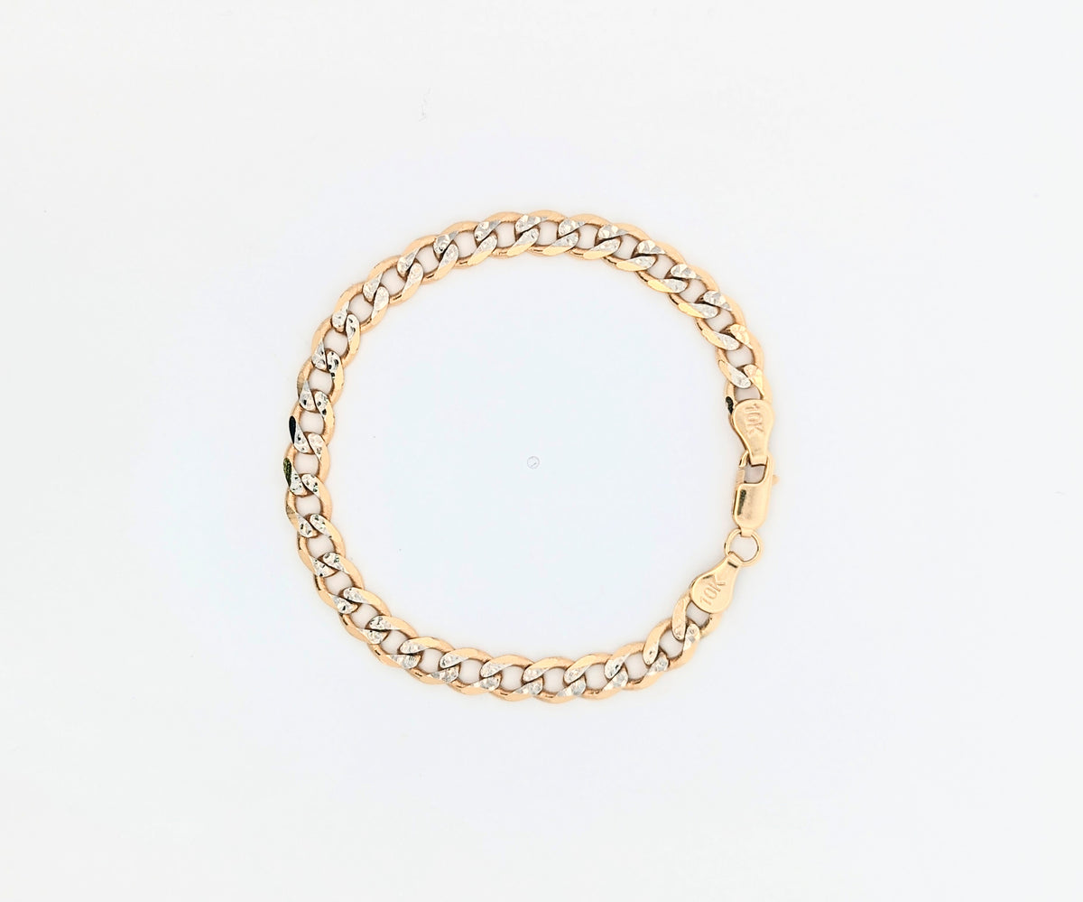 10k yellow gold flat curb link bracelet with white gold diamond cuts. 7 inch 4mm